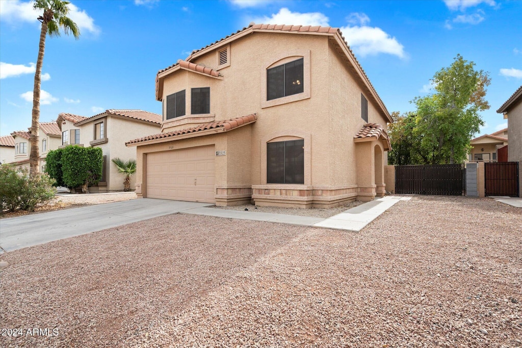 mediterranean / spanish-style house featuring a garage