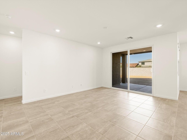 unfurnished room featuring light tile patterned floors