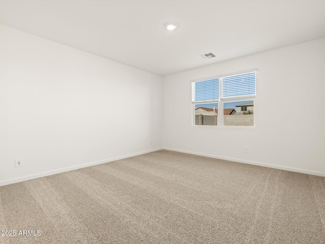 unfurnished room featuring carpet