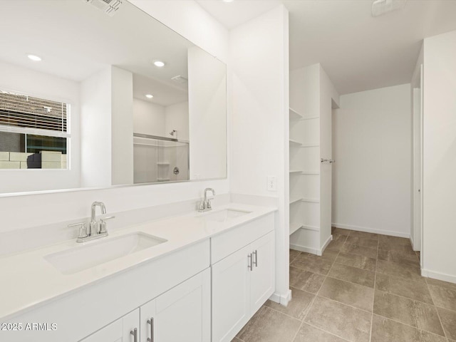 bathroom with an enclosed shower and vanity