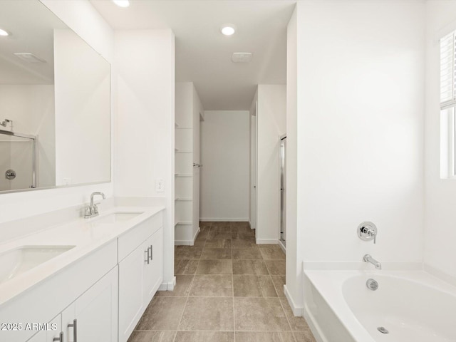 bathroom featuring separate shower and tub and vanity