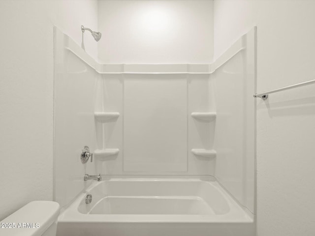 bathroom featuring toilet and shower / bathtub combination