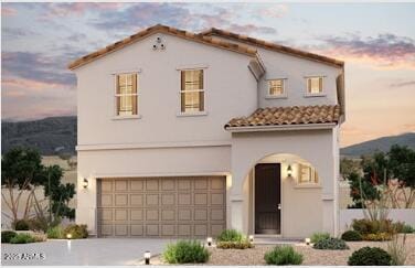 mediterranean / spanish-style house featuring a garage