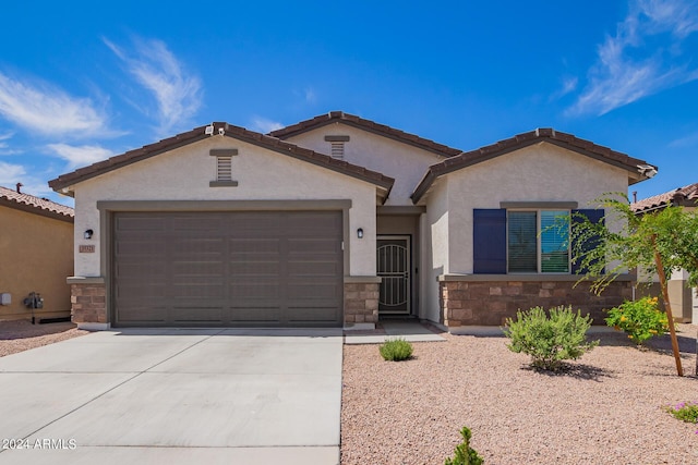 view of front of home with a garage