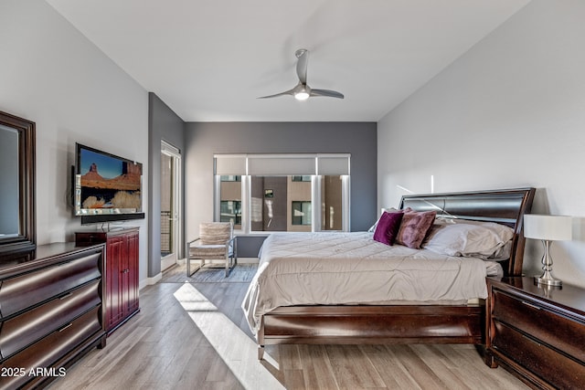 bedroom with access to outside, ceiling fan, and light hardwood / wood-style flooring