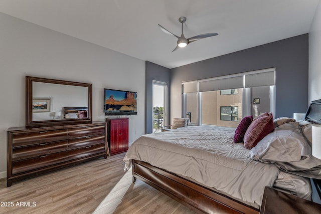 bedroom with light hardwood / wood-style flooring and ceiling fan