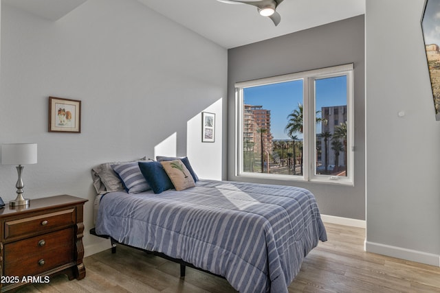 bedroom featuring ceiling fan and light hardwood / wood-style flooring