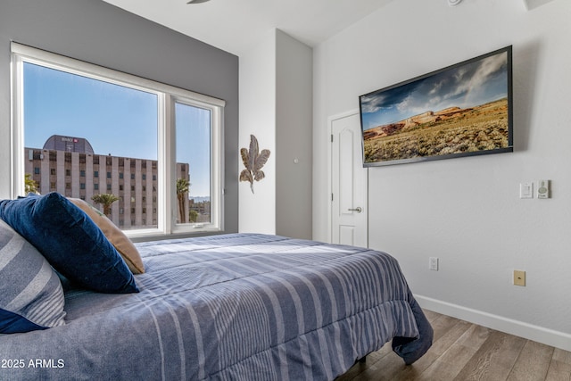 bedroom with hardwood / wood-style floors