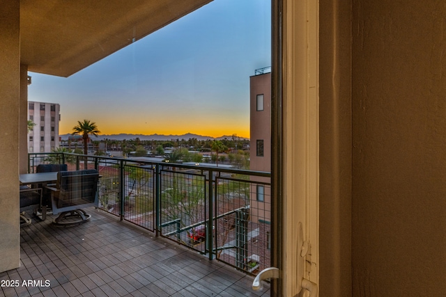 view of balcony at dusk