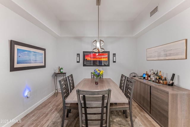 dining area with light hardwood / wood-style floors