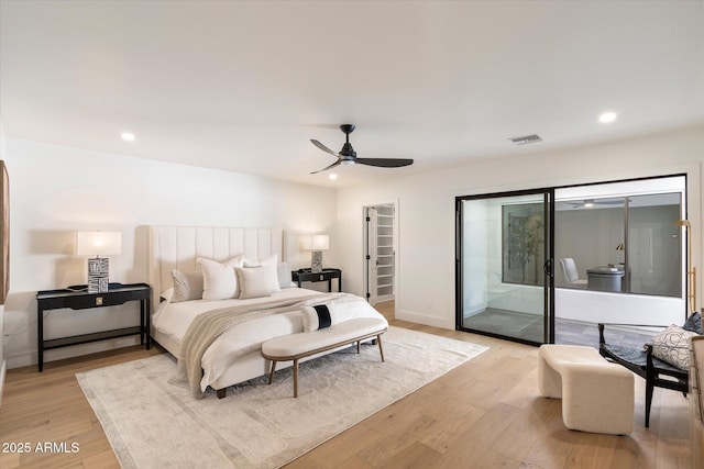 bedroom featuring light wood finished floors, visible vents, access to outside, a spacious closet, and recessed lighting