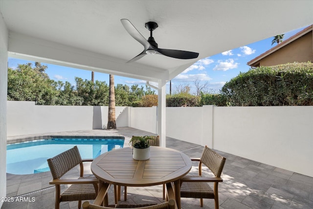 view of swimming pool with a patio area, a fenced backyard, ceiling fan, and a fenced in pool