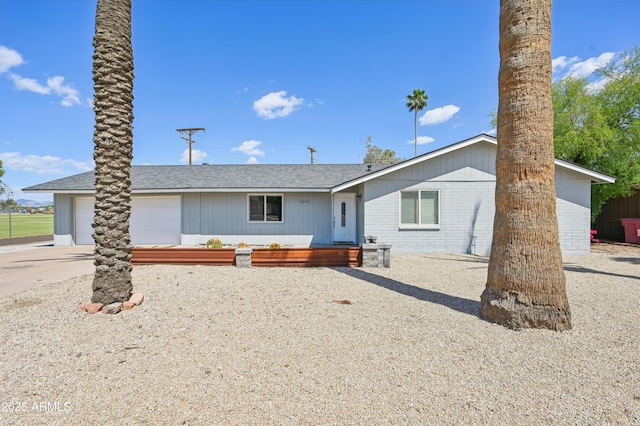 view of front of house featuring a garage and concrete driveway