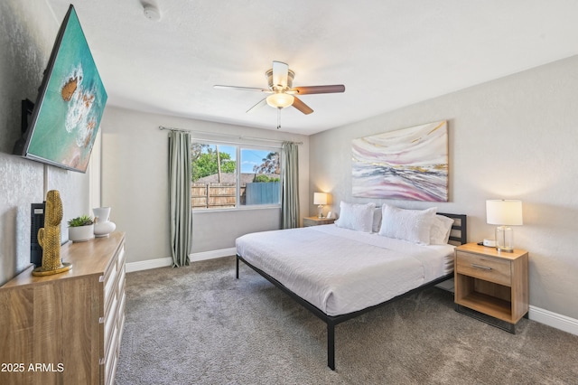 carpeted bedroom featuring baseboards and ceiling fan
