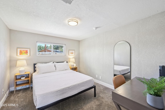 bedroom featuring carpet floors, a textured ceiling, and baseboards