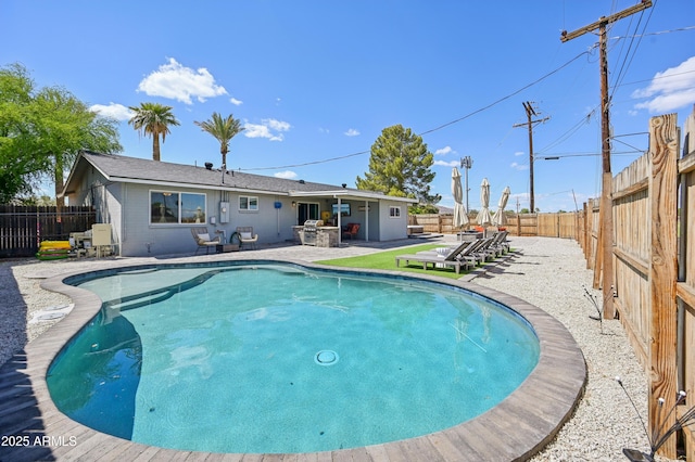 view of swimming pool with a fenced backyard, a fenced in pool, and a patio