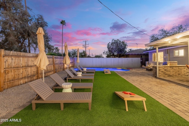 view of yard featuring a fenced in pool, a patio, and a fenced backyard