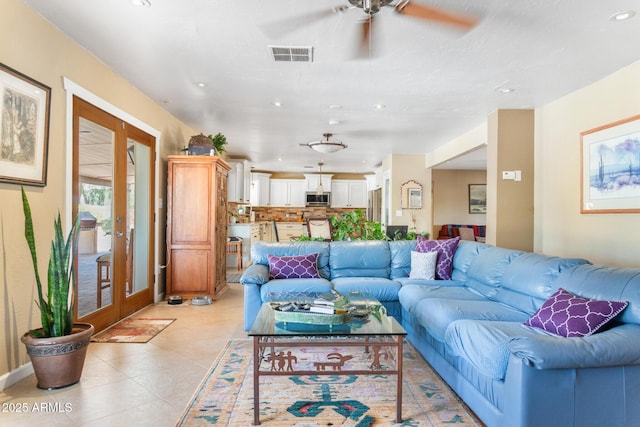 12212 N 66th St, Scottsdale, AZ 85254 - living room with french doors, a ceiling fan, recessed lighting, and light tile patterned floors