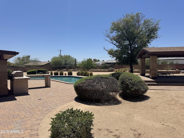 12212 N 66th St, Scottsdale, AZ 85254 - view of swimming pool featuring a gazebo, a patio, and grilling area