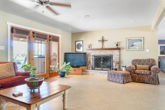12212 N 66th St, Scottsdale, AZ 85254 - living room with ceiling fan, a stone fireplace, tile patterned floors, and recessed lighting