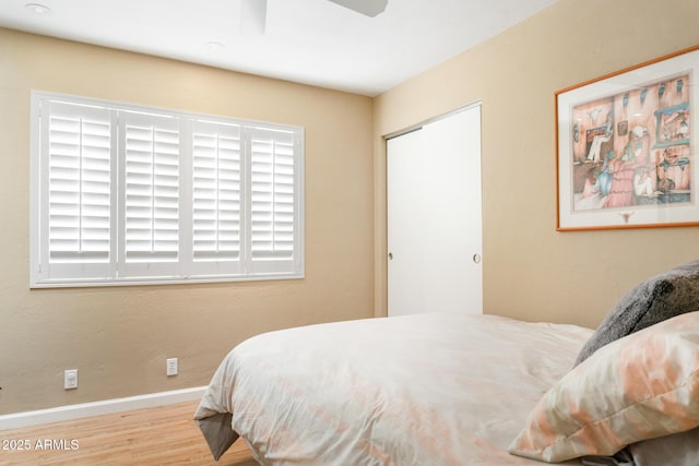 12212 N 66th St, Scottsdale, AZ 85254 - bedroom with wood finished floors and ceiling fan