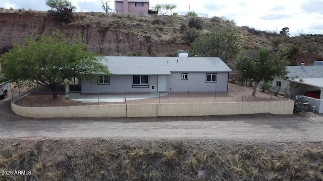 back of house featuring a patio and fence