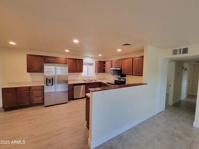 kitchen with recessed lighting, visible vents, and appliances with stainless steel finishes
