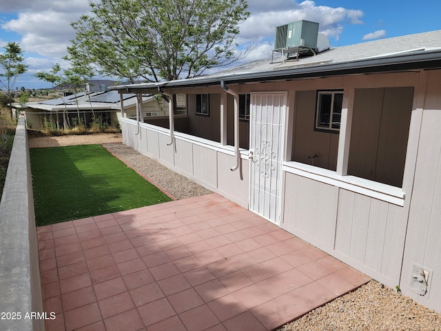 view of patio featuring fence and central AC