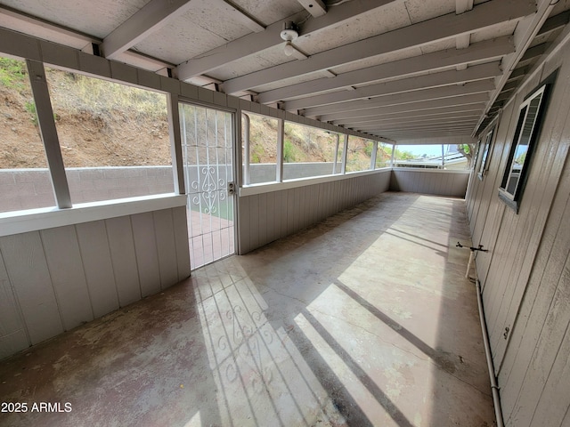 unfurnished sunroom with a wealth of natural light