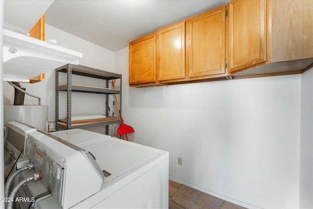 laundry area with cabinets and separate washer and dryer