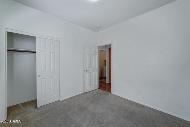 unfurnished bedroom with a closet and light carpet