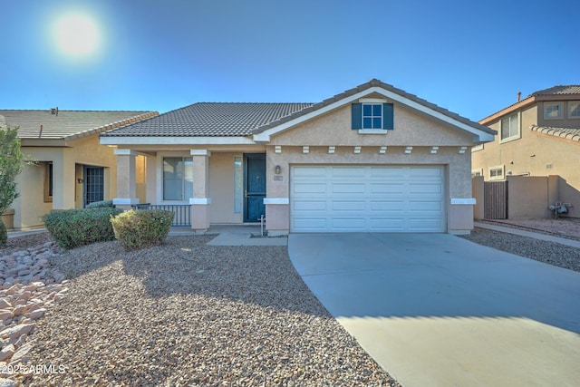 view of front of property featuring covered porch and a garage