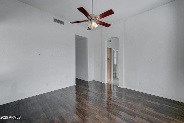 unfurnished room with ceiling fan and dark wood-type flooring