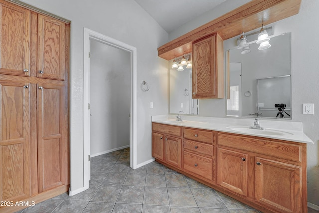 bathroom with tile patterned flooring, vanity, and toilet