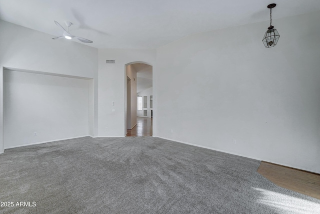 carpeted empty room with ceiling fan