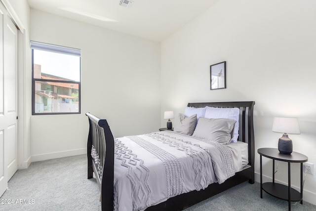 carpeted bedroom with a closet