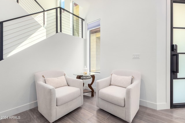 living area with hardwood / wood-style flooring