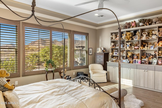 bedroom featuring visible vents, crown molding, ceiling fan, recessed lighting, and wood finished floors