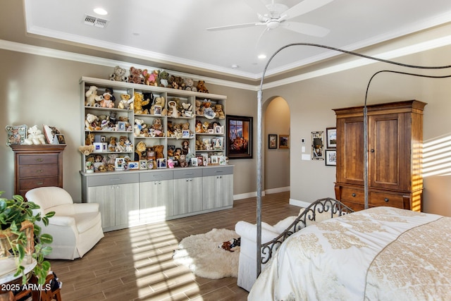bedroom with visible vents, arched walkways, wood tiled floor, and crown molding