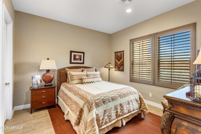 bedroom with recessed lighting, baseboards, visible vents, and light wood finished floors