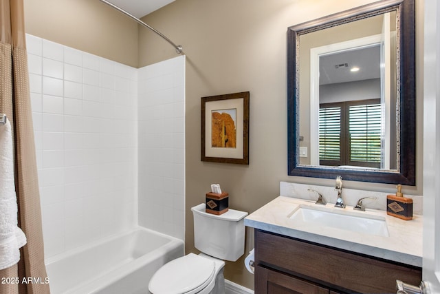 full bathroom with visible vents, vanity, toilet, and shower / bathtub combination