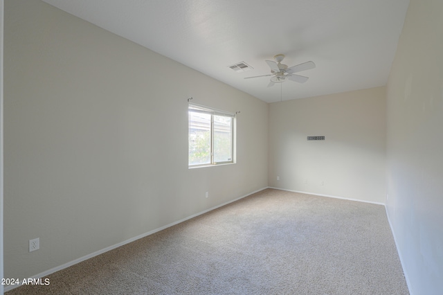 empty room with carpet flooring and ceiling fan