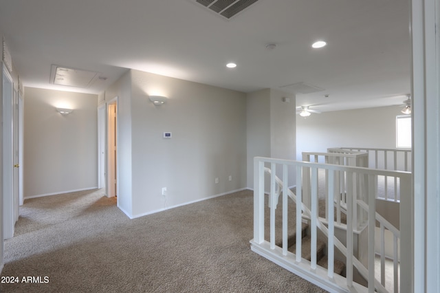 unfurnished room with light carpet and ceiling fan