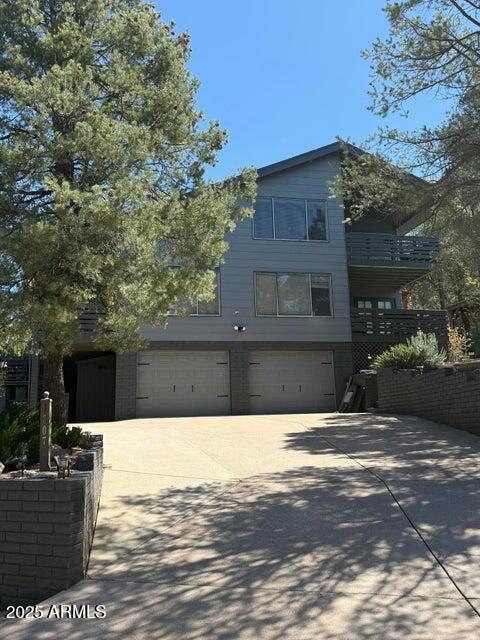 exterior space with a garage and concrete driveway