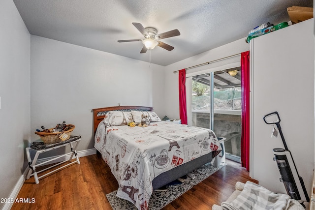 bedroom featuring baseboards, a textured ceiling, a ceiling fan, access to exterior, and wood finished floors
