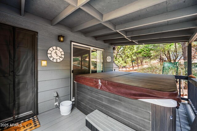 deck featuring a hot tub