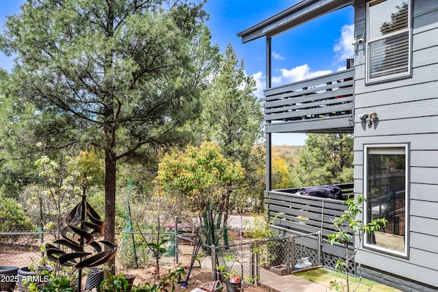 exterior space with fence and a balcony