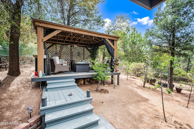 view of patio featuring a gazebo, a grill, and a wooden deck