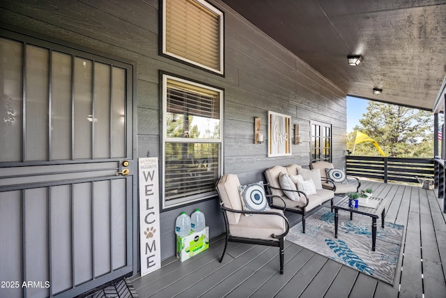 wooden terrace with outdoor lounge area