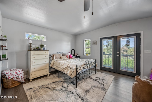 bedroom featuring access to outside, french doors, wood finished floors, and lofted ceiling